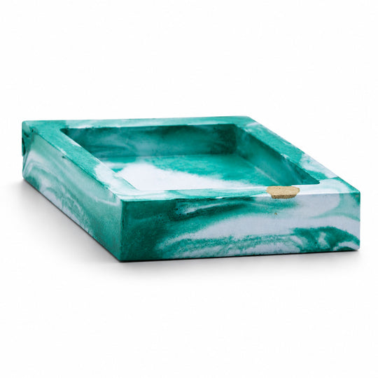 Marble-patterned tray with green and white colors on a white background