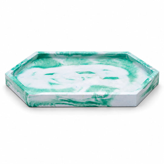 Hexagonal marble tray with green and white pattern on a white background