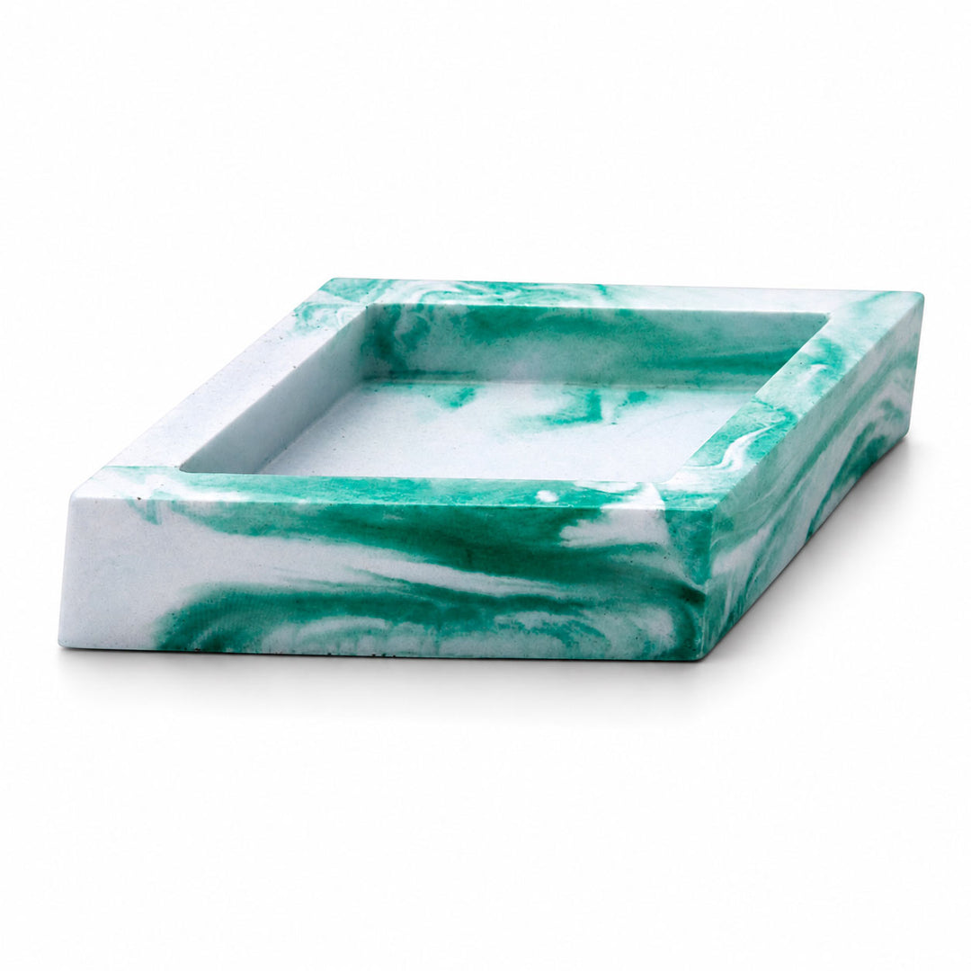 Marble-patterned square tray with green and white swirled design on a white background