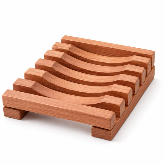 A set of five curved wooden wine bottle coasters stacked on top of each other, made from warm reddish-brown wood with a smooth finish, photographed on a clean white background.