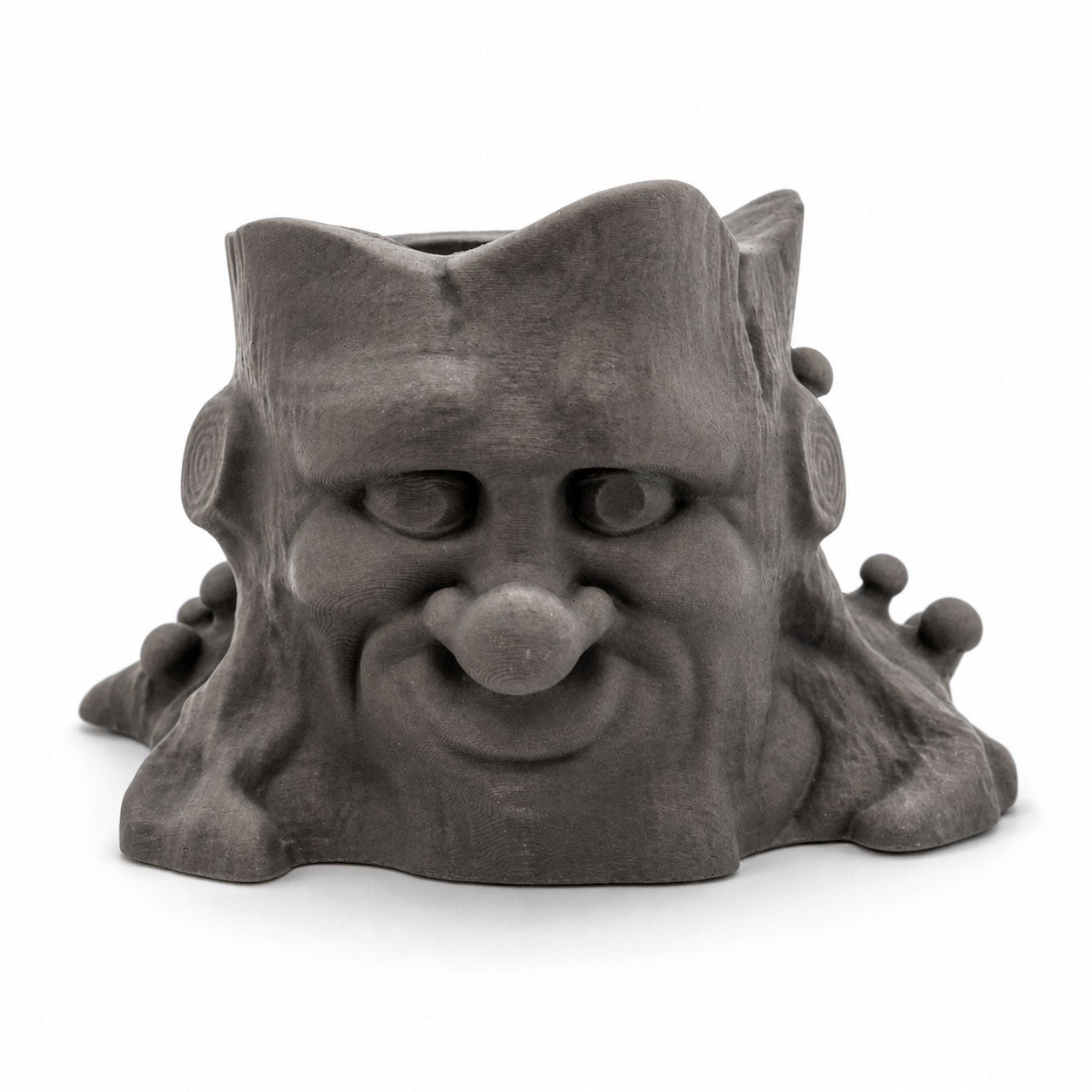 Gray gargoyle-like ceramic planter on a white background
