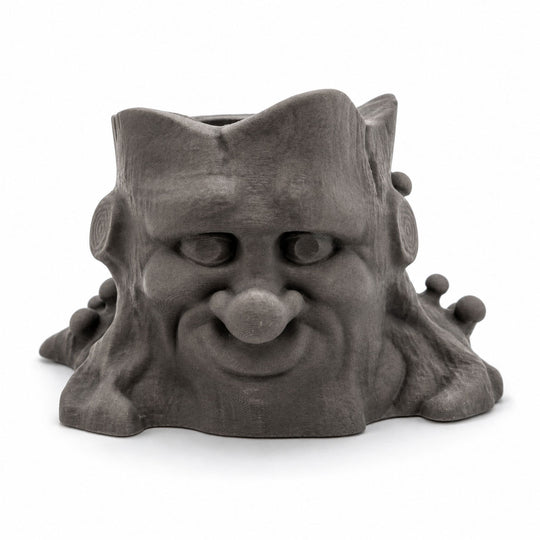 Gray gargoyle-like ceramic planter on a white background
