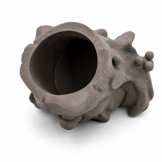 Brown ceramic vase with unique design on a white background