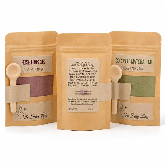 Three packages of clay face masks from The Salty Lady on a white background