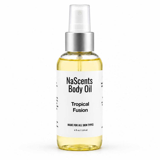 A bottle of NaScents Body Oil in the Tropical Fusion scent, featuring a clear spray top, silver collar, and a white label with black text, set against a plain white background.