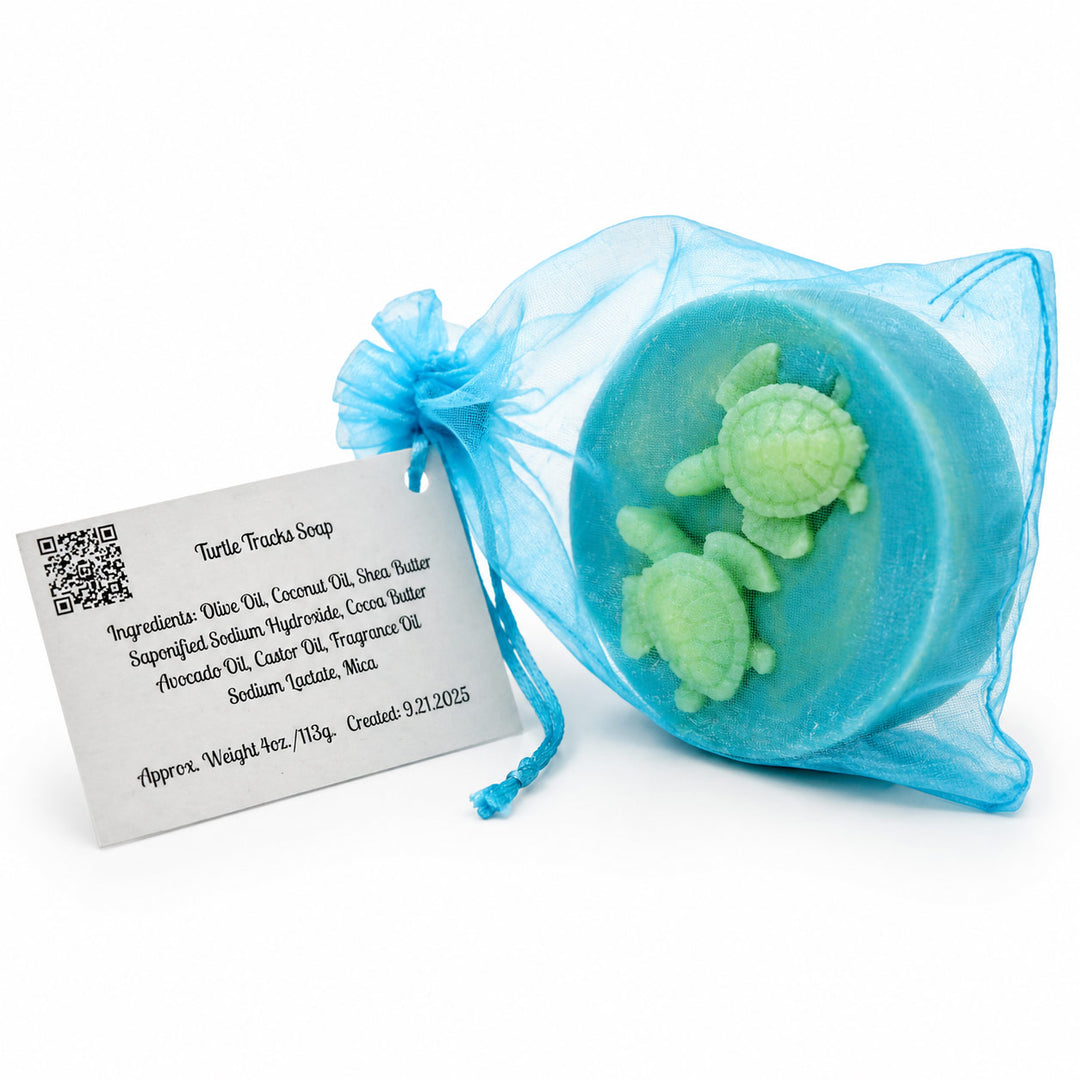 Blue soap with turtle design in a clear bag on a white background