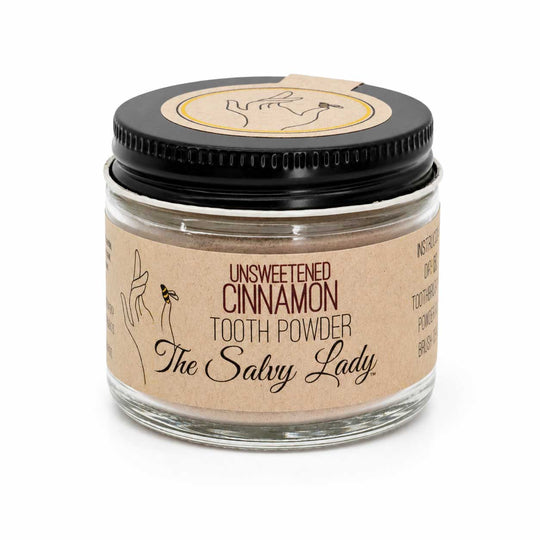 Jar of unsweetened cinnamon tooth powder by The Salvy Lady on a white background