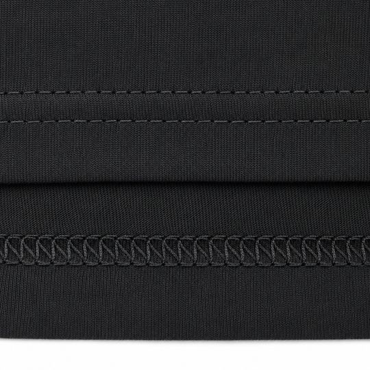Close-up of black fabric with stitching detail on a white background