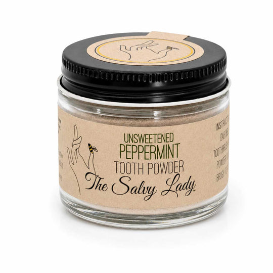 Jar of unsweetened peppermint tooth powder with 'The Salvy Lady' branding on a white background