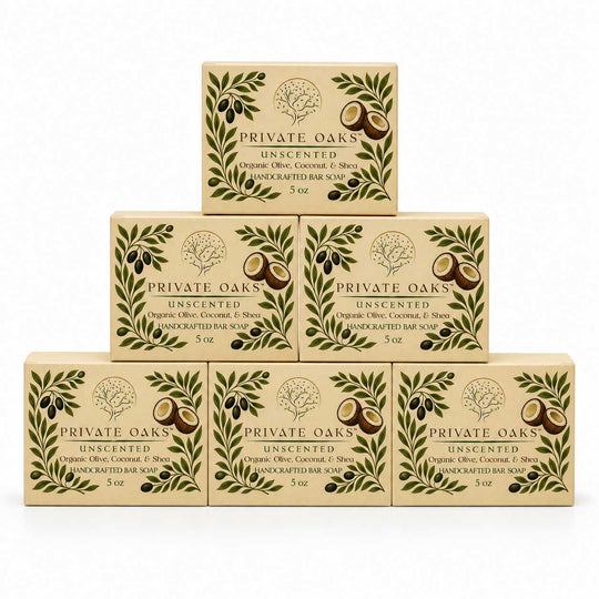 Six boxes of Private Oaks Unscented Organic Olive, Coconut, and Tea Unscented Bar Soap arranged in a pyramid stack on a white background.