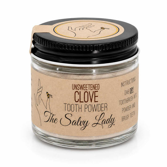 Glass jar of 'Unsweetened Clove Tooth Powder' by 'The Salvy Lady' on a white background