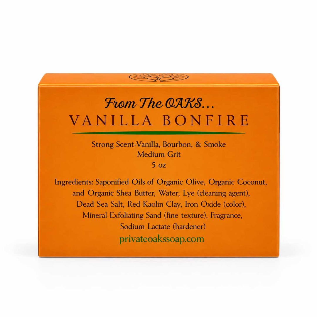 Orange rectangular box for Vanilla Bonfire exfoliating soap by The Oaks, shown on a clean white background. The front features black text detailing the scent and ingredients, with the website privateoakssoap.
