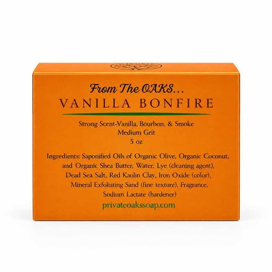 Orange rectangular box for Vanilla Bonfire exfoliating soap by The Oaks, shown on a clean white background. The front features black text detailing the scent and ingredients, with the website privateoakssoap.