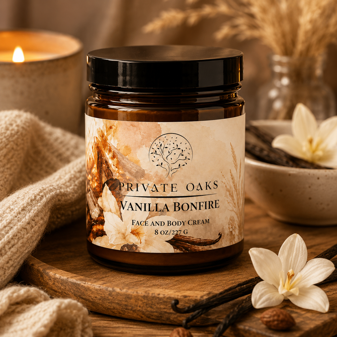A jar of Private Oaks Vanilla Bonfire face and body cream sits on a wooden board in a cozy, warm setting with a lit candle, knitted fabric, and vanilla beans.