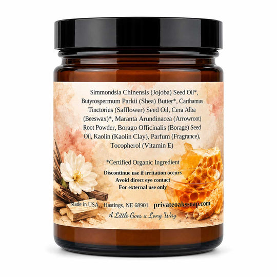An amber glass jar of Simondsia Chinensis (Jojoba) Seed Oil with a black lid and a detailed ingredient label, shown against a plain white background.