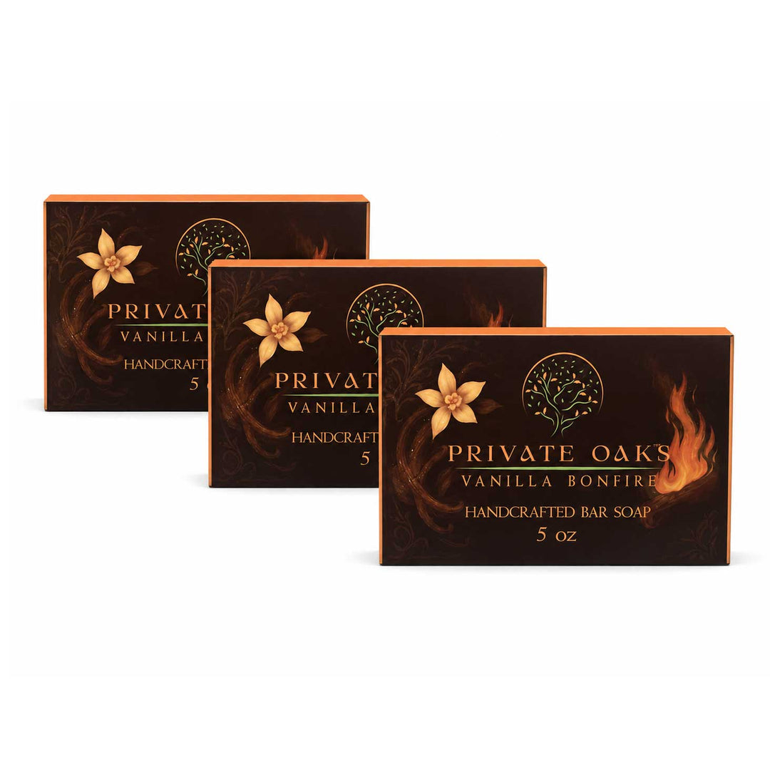 Three boxes of Private Oaks Vanilla Bonfire Handcrafted Bar Soap arranged in a staggered row on a white background.