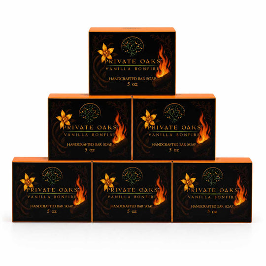 Six boxes of Private Oaks Vanilla Bonfire Handcrafted Bar Soap arranged in a pyramid stack on a white background.