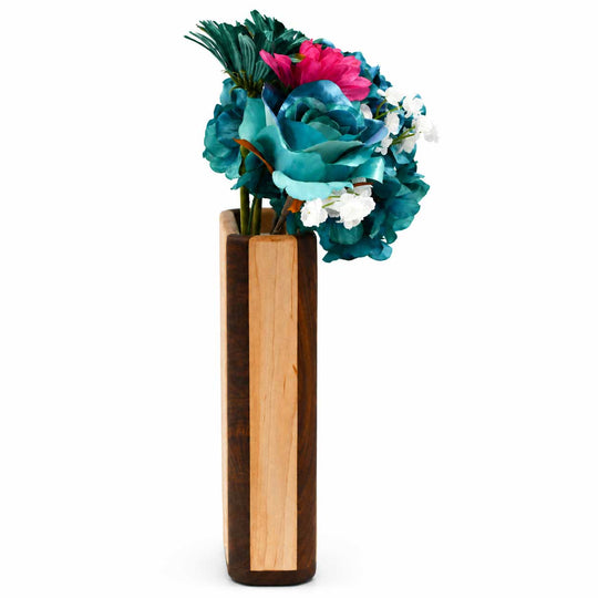 Wooden vase with colorful flowers on a white background