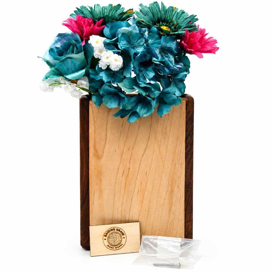 Wooden vase with colorful flowers on a white background