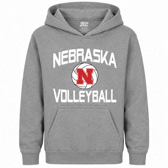 A heather gray pullover hoodie featuring a 'Nebraska Volleyball' graphic on the chest. The design includes the word 'NEBRASKA' in white arched text above a volleyball graphic with a red 'N' logo, and 'VOLLEYBALL' in white text below.