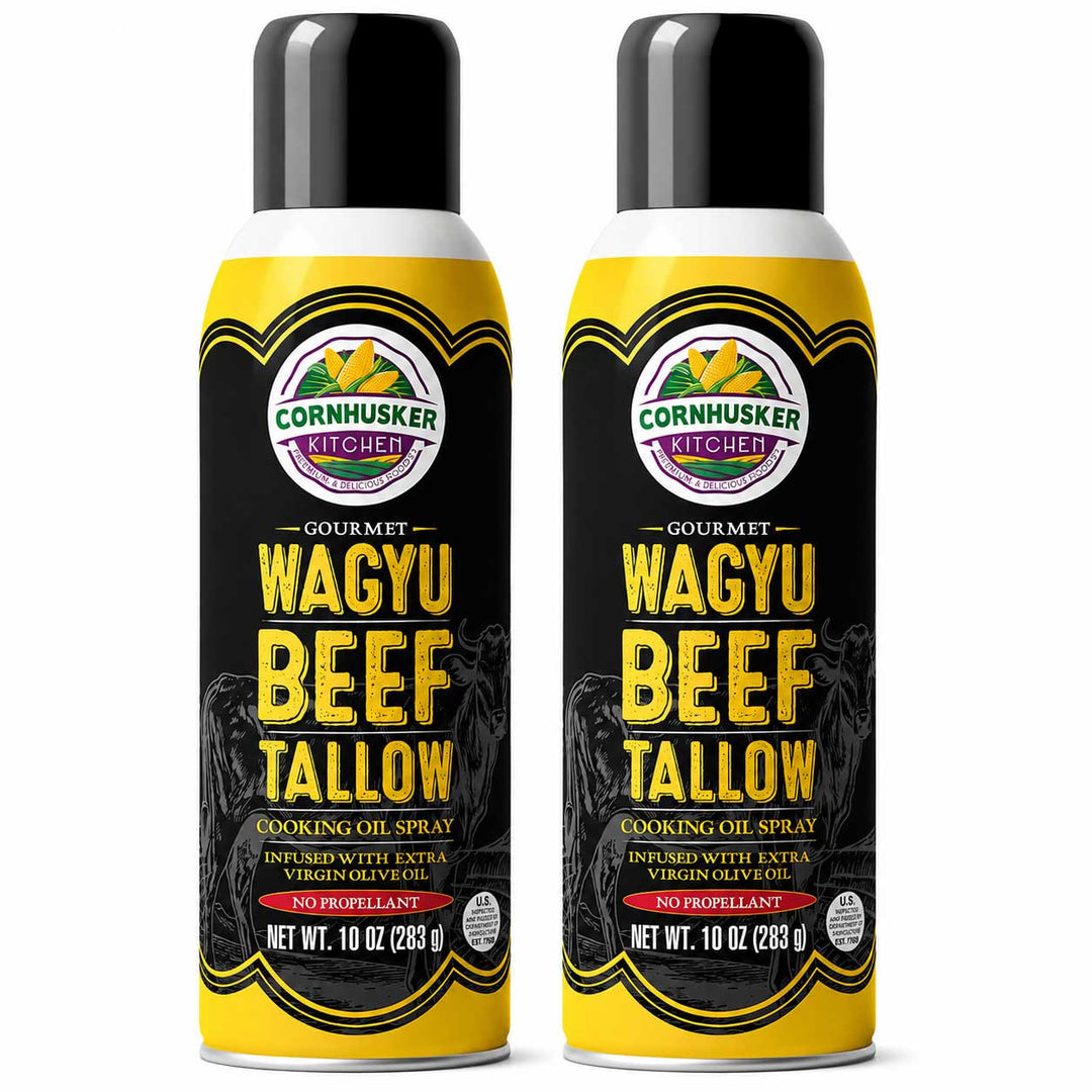 Two aerosol cans of Cornhusker Kitchen Gourmet Wagyu Beef Tallow Cooking Oil Spray, shown side by side on a white background.