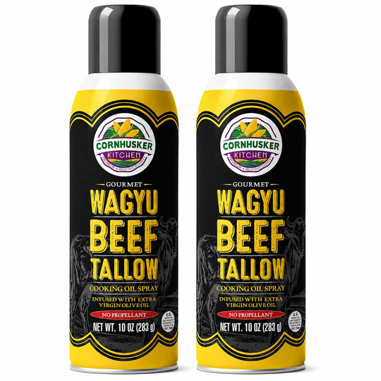 Two aerosol cans of Cornhusker Kitchen Gourmet Wagyu Beef Tallow Cooking Oil Spray, shown side by side on a white background.