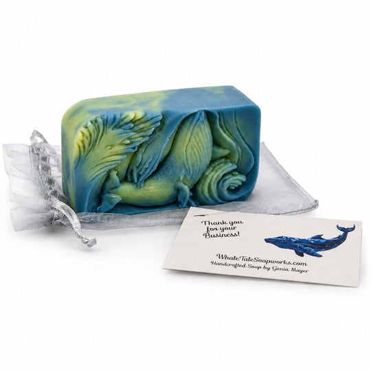 Blue and green soap bar with a business card on a white background