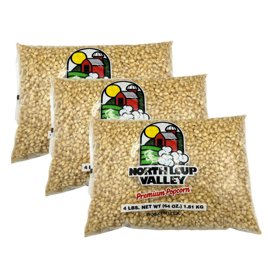 Three bags of North Loop Valley premium popcorn on a white background