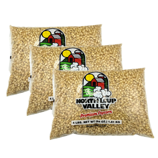 Three bags of North Loop Valley premium popcorn on a white background
