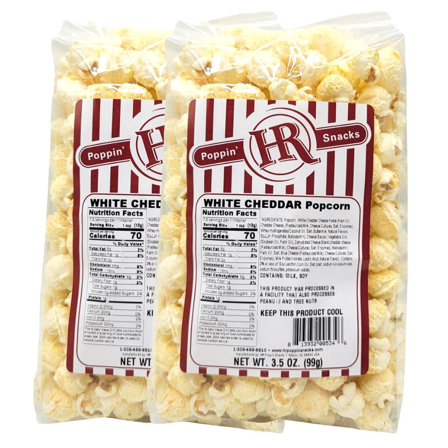 Two packages of HR Poppin' Snacks White Cheddar Popcorn on a white background