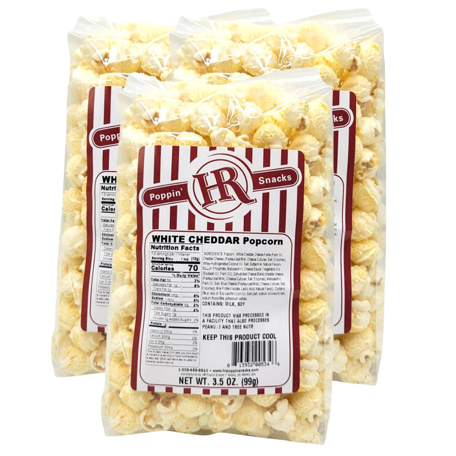 Three bags of white cheddar popcorn with an HR Poppin Snacks label on a white background.