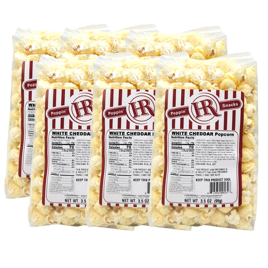 Six bags of HR Poppin' Snacks White Cheddar Popcorn on a white background