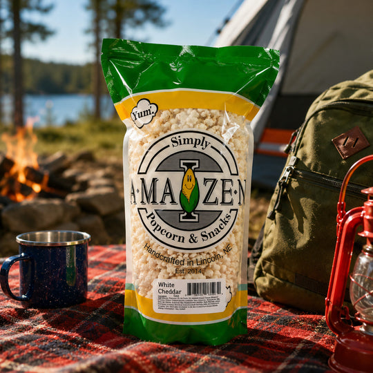 White Cheddar Simply Amaizen popcorn at a campsite
