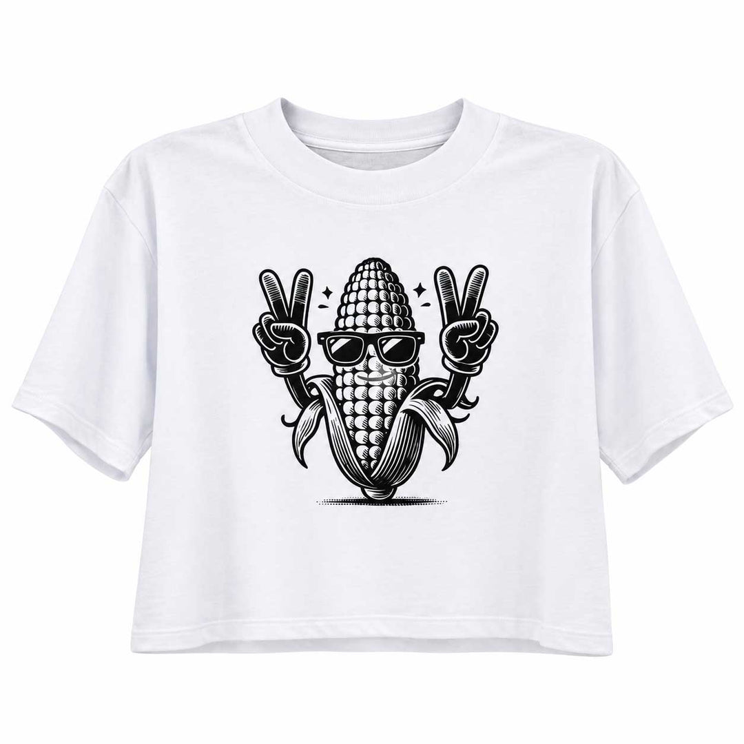 A white short-sleeve crop top t-shirt featuring a black graphic of a corn cob wearing sunglasses and making peace signs.