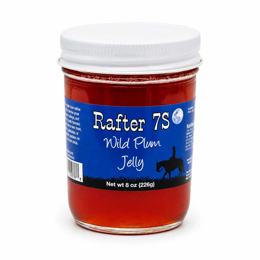 Jar of Rafter 7S Wild Plum Jelly with a blue label on a white background