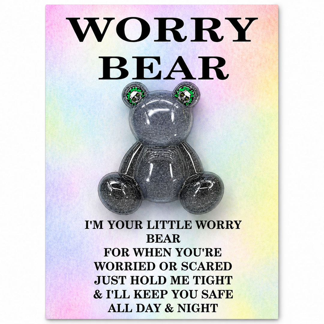 Silver glittery bear with green eyes on a rainbow gradient background with text.