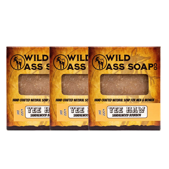 Three bars of Wild Ass Soap in packaging on a white background
