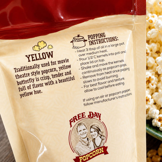 Popcorn bag with popping instructions and 'Free Day Popcorn' branding.