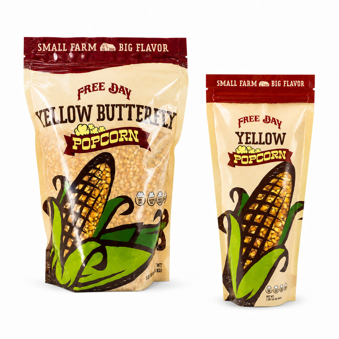 Two packages of Free Day Yellow Butterfly Popcorn on a white background