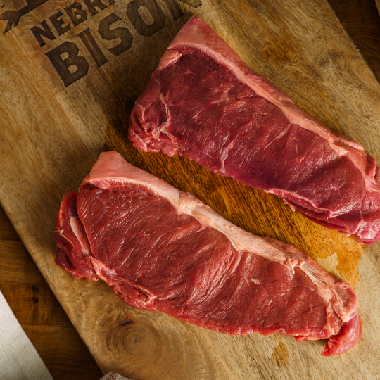 New York Strips | 4 - 10 oz. Nebraska Bison Steaks | 100% All Natural Bison Meat | Flavorful and Great For Grilling | The Perfect Steak : Tasty, Flavorful, & Tender | High Protein Cut Of Meat | Tender, Juicy Steak