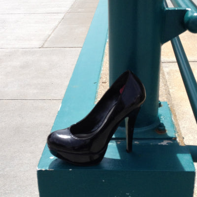 One Shoe on a Lincoln Street Corner | By Kent Theesen