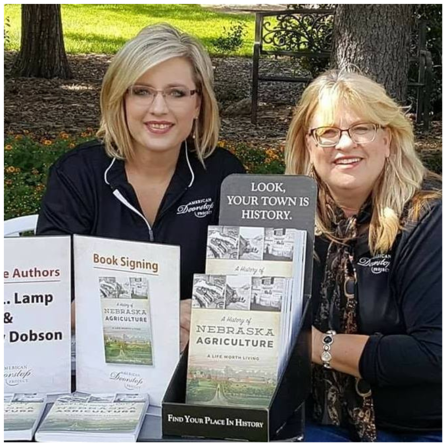 Image Of American Doorstep Project Employees Posed With A History Of Nebraska Agriculture: A Life Worth Living Book