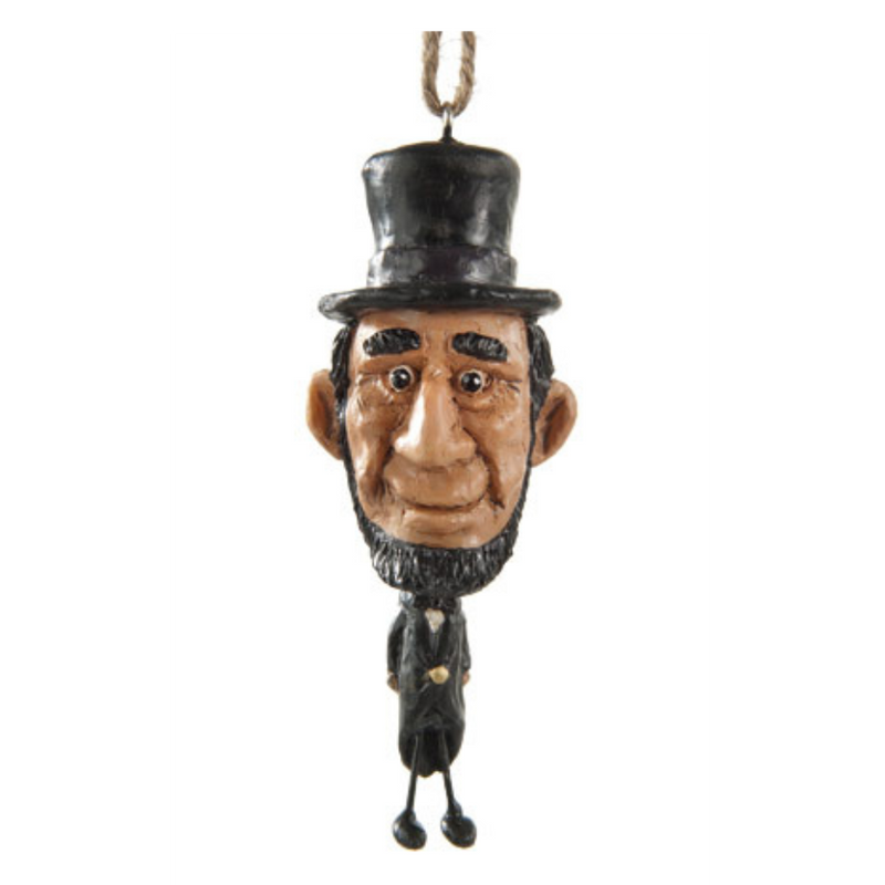 Abe Lincoln ornament with oversize head on a white background