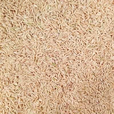 Pile Of Whole, Raw, Organic Long Grain Brown Rice