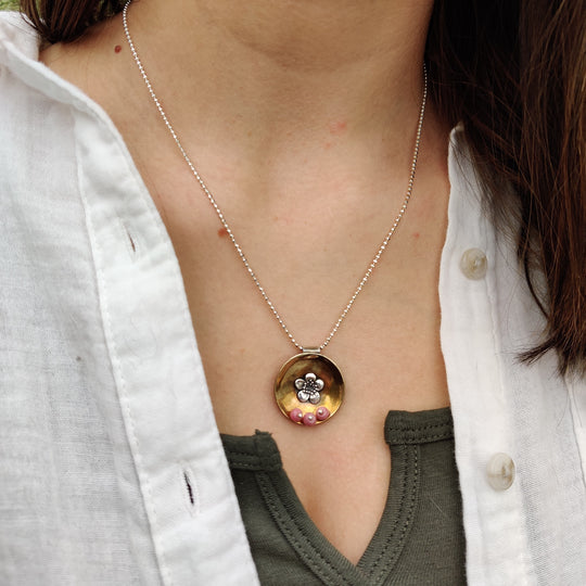 Concave Brass Disc Sterling Flower And Rhodonite Stones Necklace | Domed Brass and Sterling Silver Soldered On | Accent of Three Rhodonite Stones | Nebraska Made Jewelry | Elegant, Simple Necklace