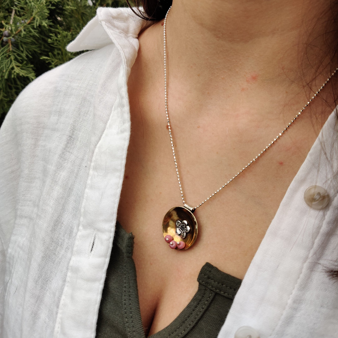 Concave Brass Disc Sterling Flower And Rhodonite Stones Necklace | Domed Brass and Sterling Silver Soldered On | Accent of Three Rhodonite Stones | Nebraska Made Jewelry | Elegant, Simple Necklace