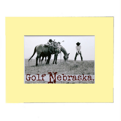 Black And White Photograph Of A Cowboy Golfing Next To A Horse 