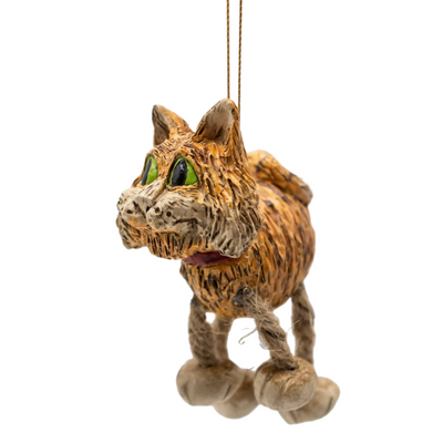 Side view of orange cat ornament with jute-rope legs shown on a white background