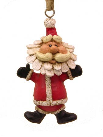 Santa ornaent with arms and legs outstretched on a white background